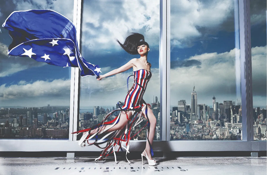 Model in a hand-painted stars-and-stripes gown above the New York skyline, 2014