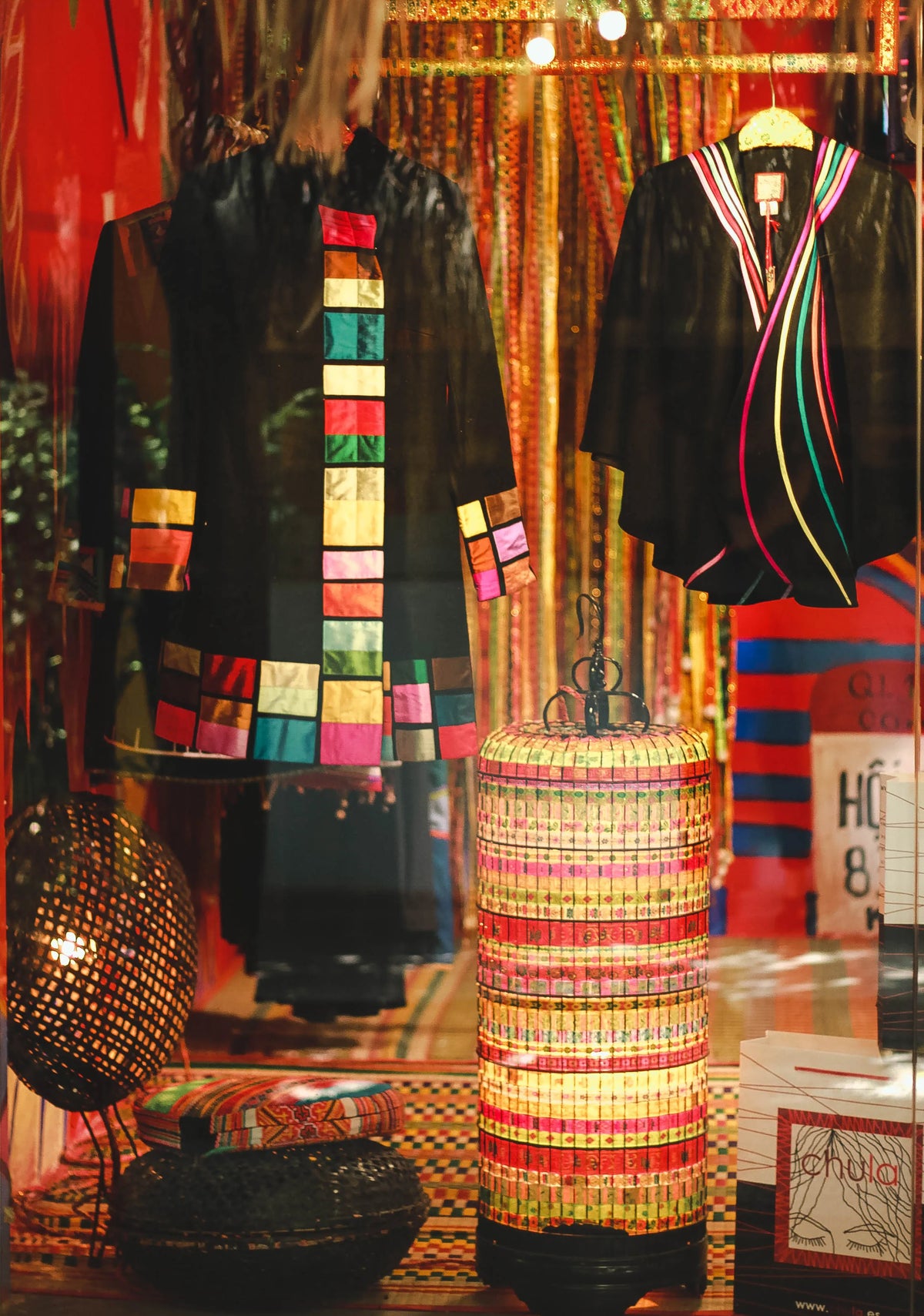 The Saigon store display of hand-painted coats and woven lamps