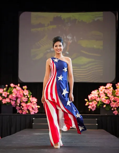 Model in a stars-and-stripes gown on the runway at the Kennedy Center, Washington DC, 2014