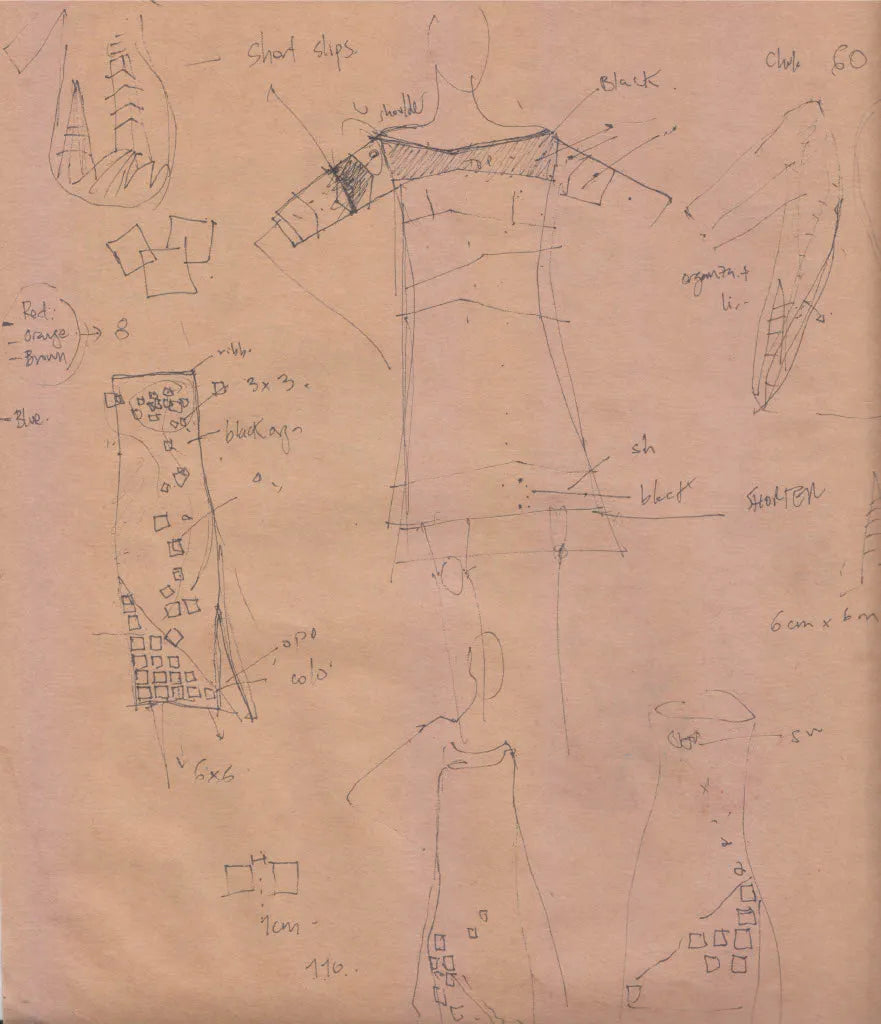A page of early pencil design sketches on brown paper, 2007