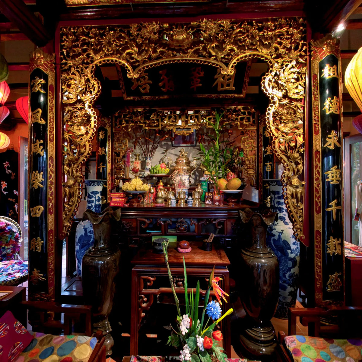 The gilded ancestral altar at the 3 Nhat Chieu house in Tay Ho