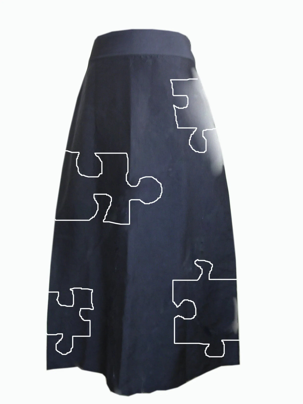 Navy skirt drawn in white line with jigsaw pieces, an early design