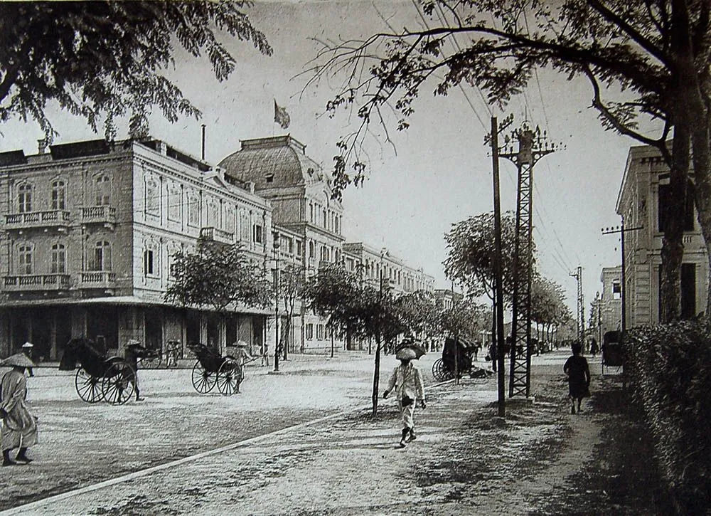 An archive photograph of the Hotel Metropole and its avenue in Hanoi