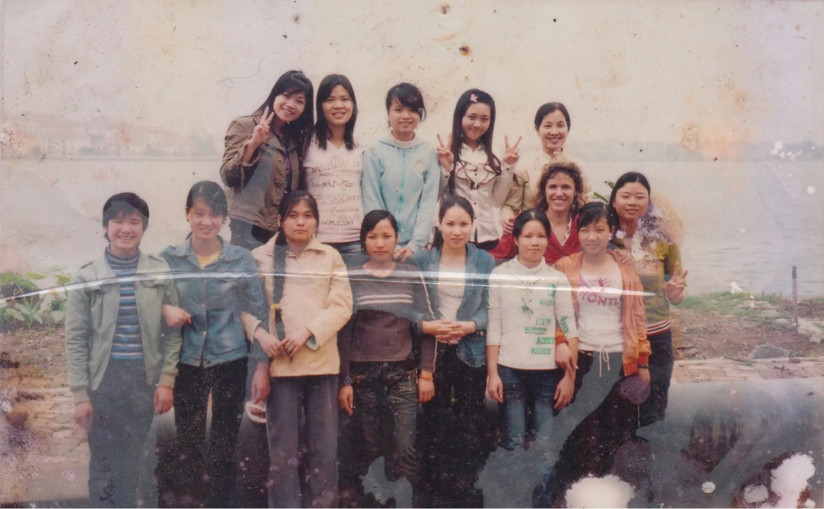 A faded group photograph of the early Chula team in Vietnam